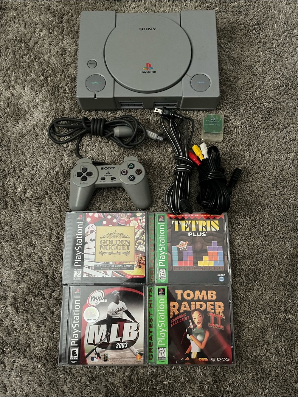 Sony Gray PlayStation Console with Controller, AV Cables & 4 Games